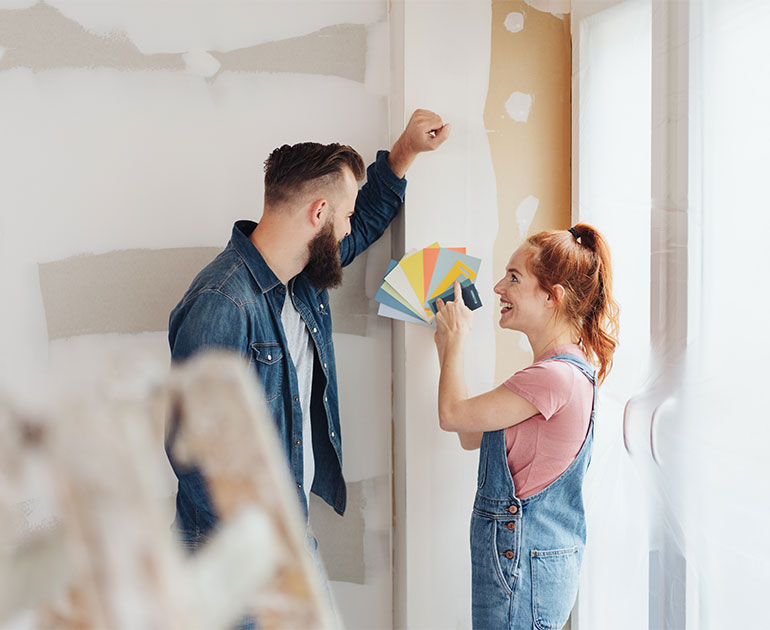 Couple choosing paint swatches
