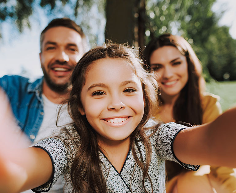 Parents and child taking selfie