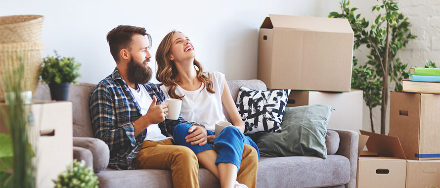 couple in new home with moving boxes