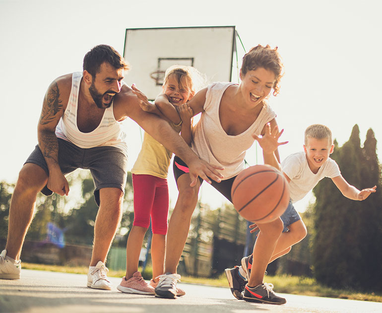 family playing basketball