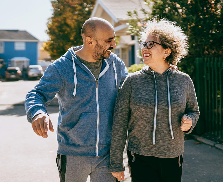Couple walking outdoors.