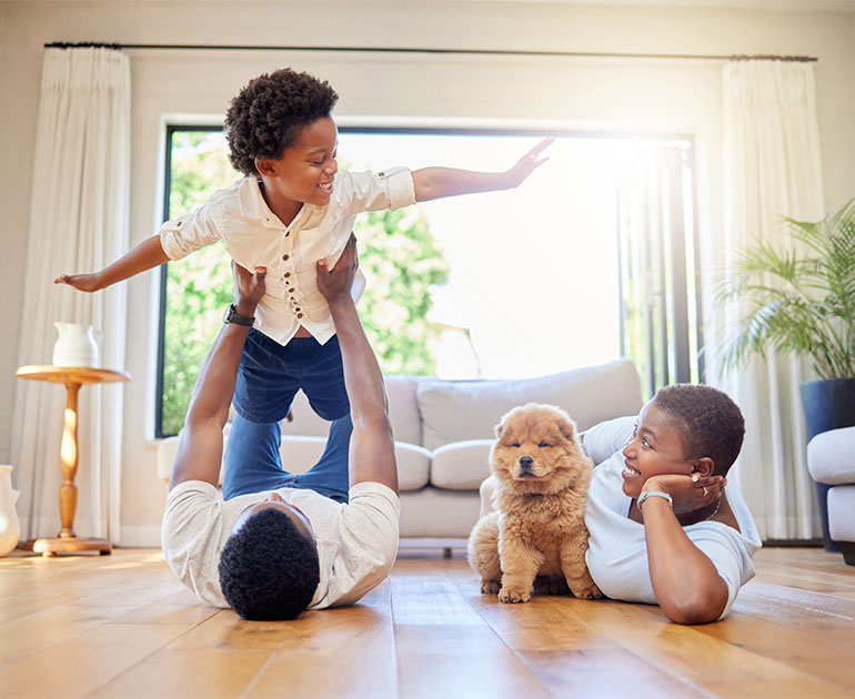 family at home with pup