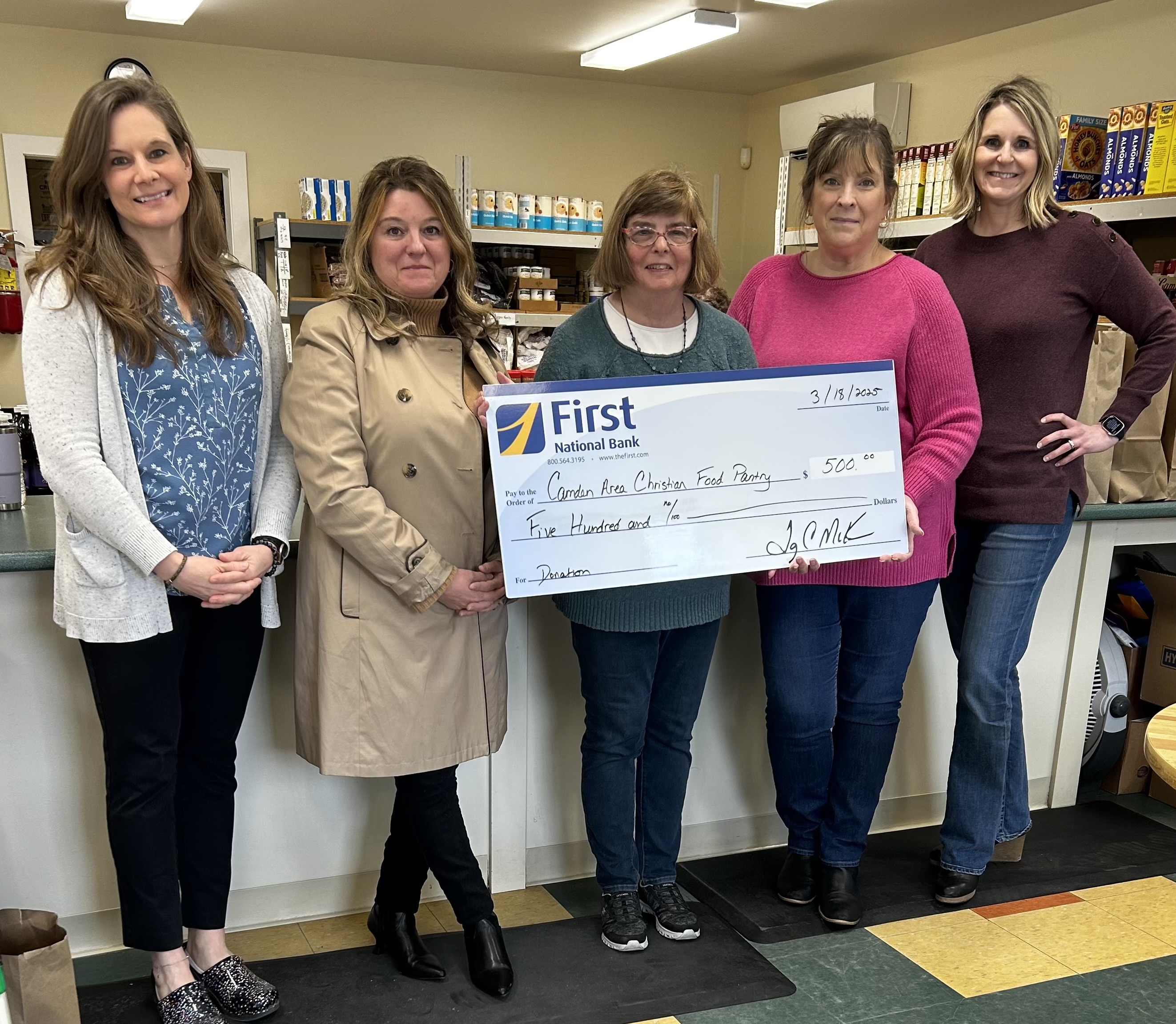 Employees presenting big check to Camden Area Food Pantry 